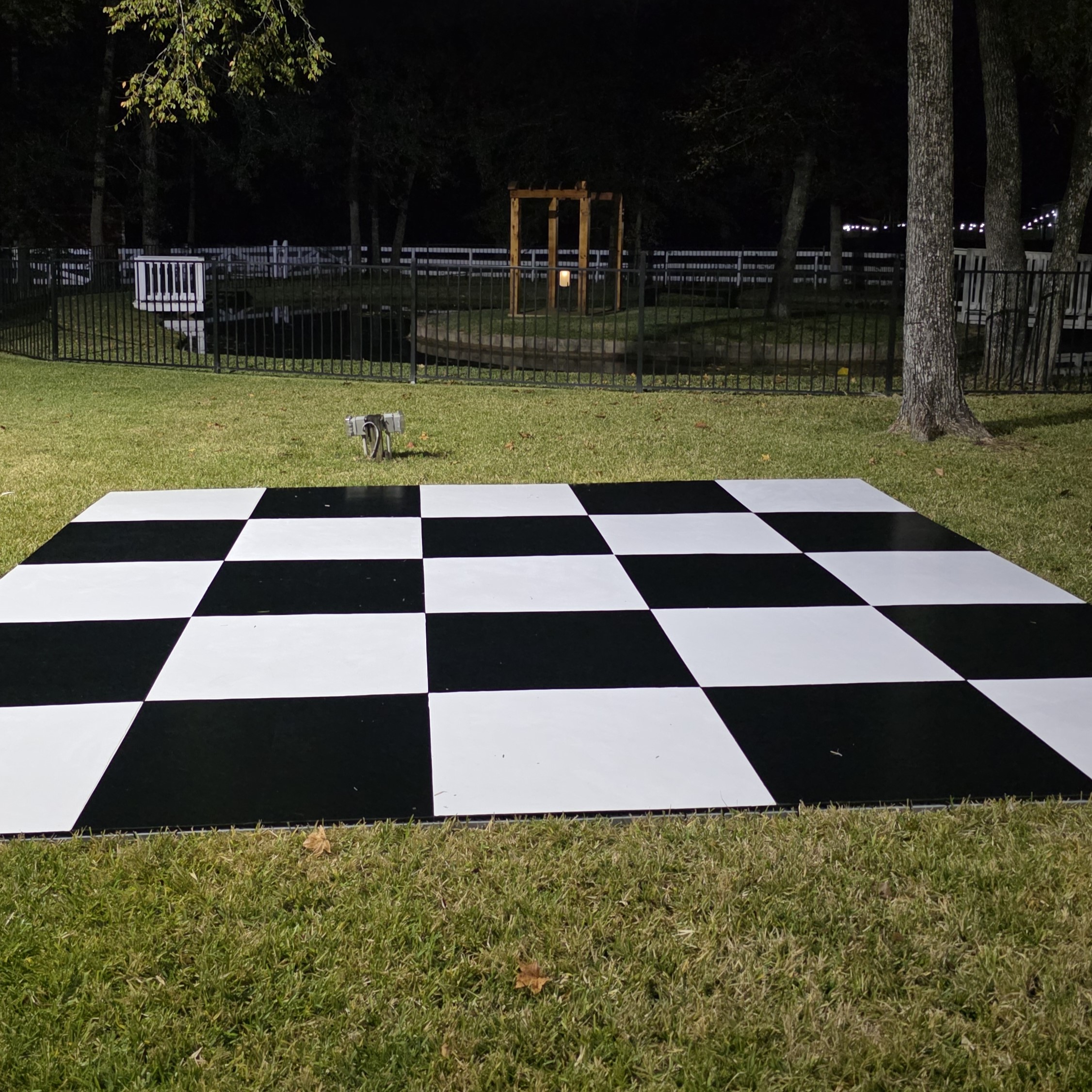 Outdoor Checkered Black and White Dancefloor on Grass